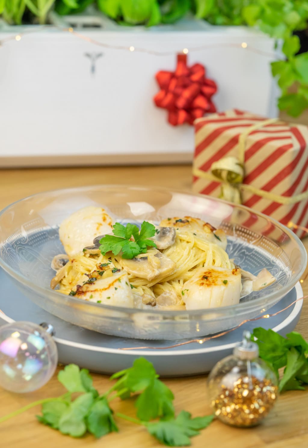 Scallops with parsley butter and capellini with forestry sauce